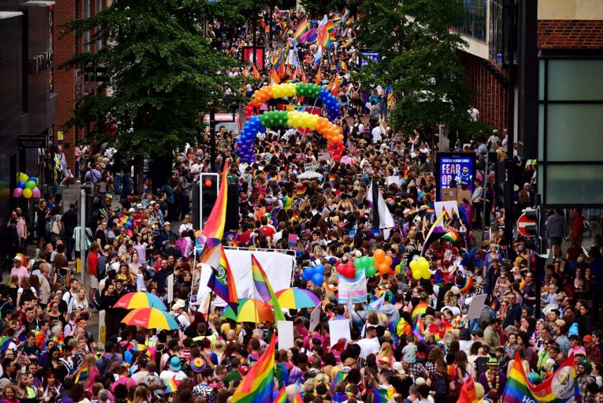 Pride parade going down a street